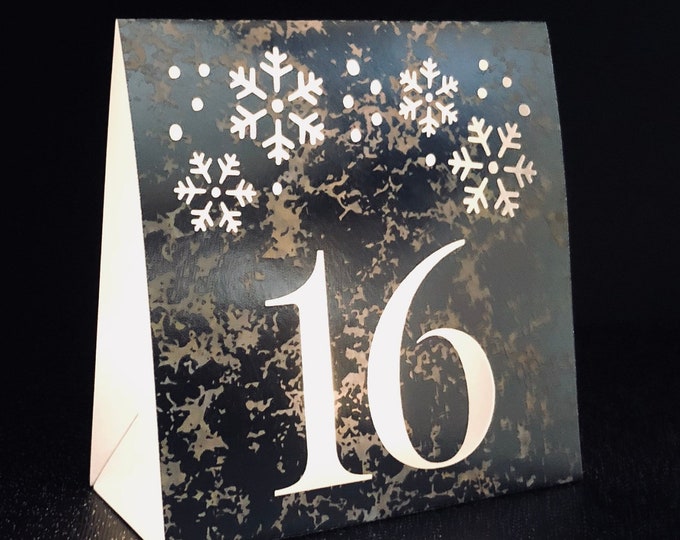 Snowflake Table Number luminaries  made with white shimmer or silver foil card stock.