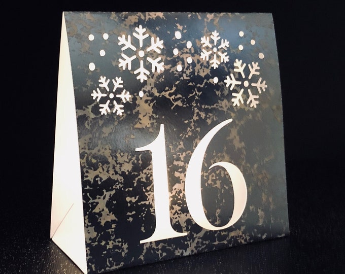 Snowflake Table Numbers made with mercury glass card stock for holiday events and weddings.