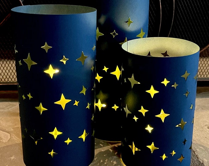 Star Luminary Centerpiece  (set of 3 Luminaries) is made from Card Stock to use with battery candles (not included). Black or Navy. Reusable