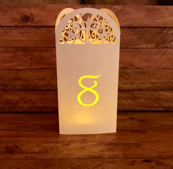 ARCH Wedding Table Number Luminaries are 3-sided cutout arches. Choose Pearl, Vanilla, Navy, Copper or Rose gold.