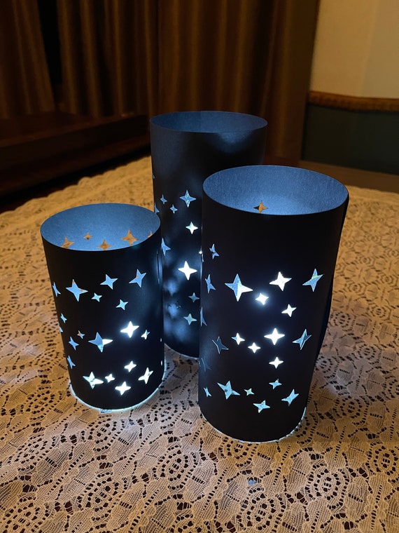 STAR LUMINARY TRIO Centerpiece  (set of 3 Luminaries) is made from Card Stock to use with battery candles (not included).