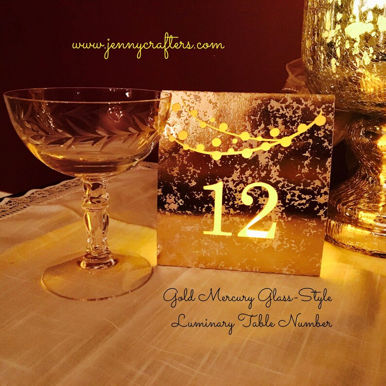 String of Lights Table Numbers are made with mercury style foil cardstock and sheer vellum paper so your battery tea lights can shine through (tea lights not included.) 
Color choices include COPPER, ROSE GOLD, GOLD, SILVER, or MIX & MATCH