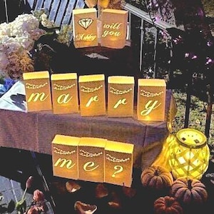 Will you marry me set of 10 mini luminaries are personalized for your amazing engagement proposal. Crafted for easy set up & transport.