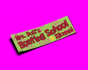 May include: Green and pink sticker with the text "Mrs. Puff's Boating School Alumni" in red letters. The sticker has a cartoon design with pink flowers and a yellow star.