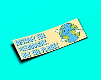 May include: A yellow sticker with blue text that reads "Destroy the Patriarchy, Not the Planet". A cartoon blue Earth with a smiling face and green continents is on the right side of the sticker.