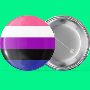 May include: A round button with a pink, white, purple, black, and blue striped design. The back of the button is silver with a pin.