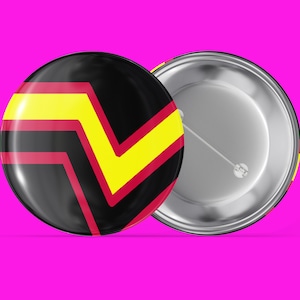 May include: A black, yellow, and red button with a zigzag pattern. The back of the button is silver.