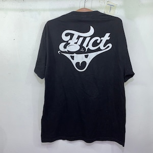 May include: Black t-shirt with a white graphic of the word "FUCT" in a stylized font. The graphic also includes a stylized image of a face with a tongue sticking out.
