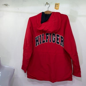 May include: Red hooded jacket with a navy blue "HILFIGER" logo on the back.