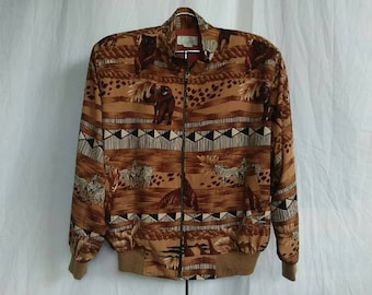 May include: A brown, beige, and black patterned jacket with a zipper closure. The pattern features animal prints and geometric designs.