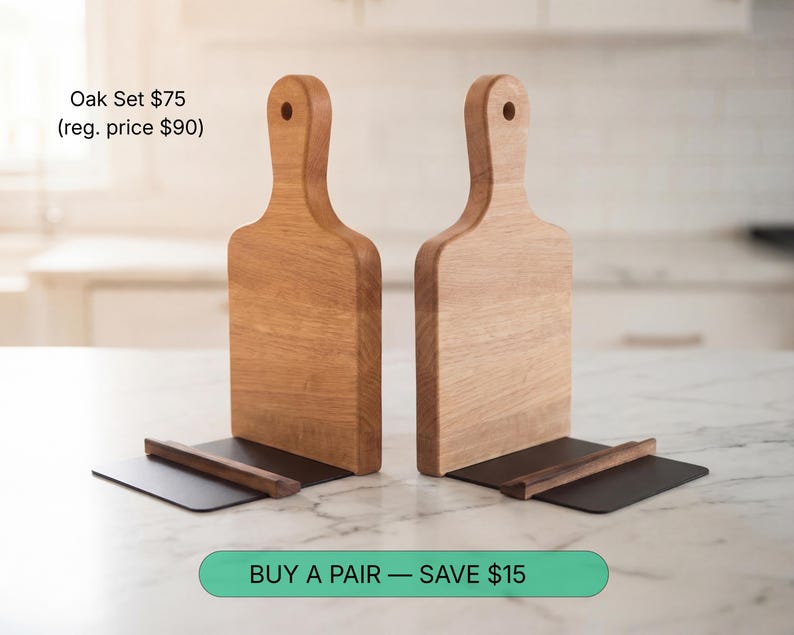 two wooden cutting boards placed on a marble countertop, with a price tag below them.