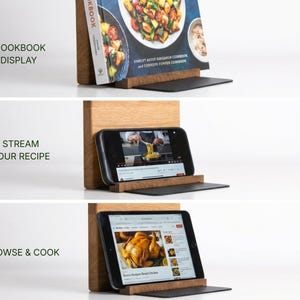 a wooden stand with a cookbook and a tablet or smartphone displaying a recipe. The stand has three sections, each with a different function: a cookbook display, a streaming display, and a browsing display.