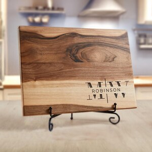 a wooden cutting board sitting on top of a table