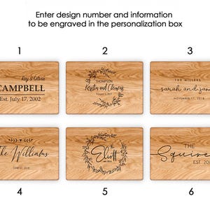 six wooden boards with personalized designs engraved on them. The boards display names and dates, such as "Ray & Oliva Campbell Est. July 17, 2002", "The Millers Sarah and James November 17, 2018", and "The Williams Ellett Est. July 27, 2018". The boards are arranged in a grid format, with each row containing three boards.