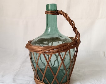 Small French vintage varnished wicker wrapped demijohn, 1950s small green glass carboy, wine bottle in handwoven wicker basket with handle