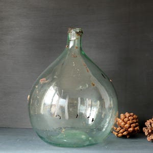 Antique French demijohn with traces of red wax, authentic 1900s large thick green glass carboy, traditional blown glass lady jeanne
