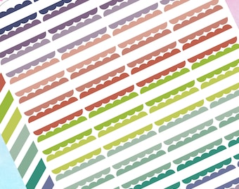 May include: A sheet of colorful scalloped border stickers. The stickers are arranged in rows and columns, with each row featuring a different color gradient. The colors include purple, pink, red, orange, yellow, green, blue, and teal.