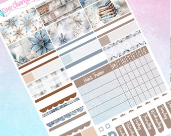 May include: A set of winter-themed planner stickers featuring snowflakes, books, and a habit tracker. The stickers are in shades of blue, brown, and white.
