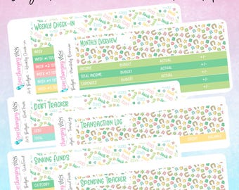 May include: A set of printable budget stickers with a whimsical design featuring a white background with green, yellow, and pink accents. The stickers include sections for weekly check-in, monthly overview, debt tracker, transaction log, sinking funds, and spending tracker.