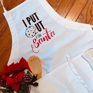I Put Out For Santa Apron. Holiday Cooking Apron. Funny Christmas Apron. Baking Lovers. Holiday Gift Giving. Custom Orders. Santa&#39;s Cookies