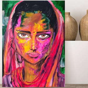 Peut inclure: Une peinture colorée d'un visage de femme avec un foulard rouge. Le visage de la femme est peint avec des couleurs vives, notamment du rose, du jaune et du vert. Le foulard est drapé sur sa tête et ses épaules.
