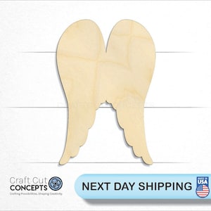 May include: A pair of wooden angel wings, unfinished and ready to be painted or decorated.  The wings are made of natural wood and have a smooth surface.