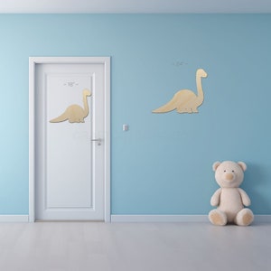 Baby Dinosaur Brontosaurus Shape sign shapes on a door and wall to view the scale.