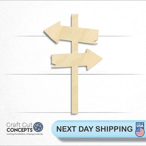 May include: Wooden signpost with two arrows pointing in opposite directions. The signpost is made of unfinished wood and is perfect for crafting and decorating.
