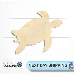 May include: A wooden cutout of a sea turtle in a light brown color. The turtle is facing right and has its head and legs extended. The cutout is made of unfinished wood and is ready to be painted or stained.
