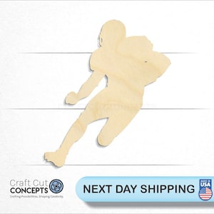 May include: Wooden cutout of a football player running with the ball. The cutout is unpainted and ready to be decorated.