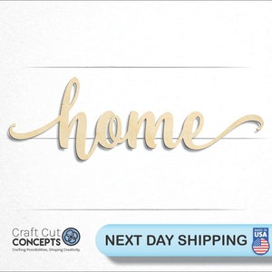 May include: Wooden cutout of the word "home" in a cursive script font. The cutout is light brown and has a slightly textured surface.