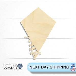 May include: A wooden cutout of a kite with a tail. The kite is light brown and has a diamond shape. The tail is made of small triangles.