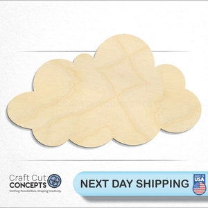 May include: A wooden cloud-shaped cutout with a light tan color. The cloud has a smooth surface and a rounded shape. The image also includes the text "Craft Cut Concepts" and "Next Day Shipping".