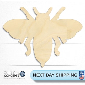 May include: A wooden cutout of a bee in a natural wood color. The bee has a simple design with wings, a body, and legs.
