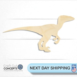May include: A wooden cutout of a velociraptor dinosaur. The dinosaur is light brown and has a long tail, a small head, and two legs. The image includes the text "Craft Cut Concepts" and "Next Day Shipping".