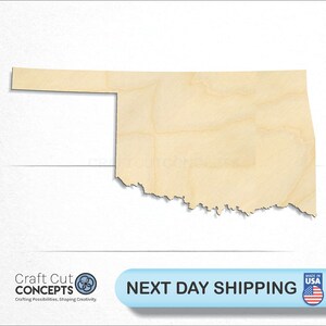 May include: A wooden cutout of the state of Oklahoma. The cutout is made of light brown wood and has a natural wood grain. The cutout is approximately 12 inches wide and 9 inches tall.