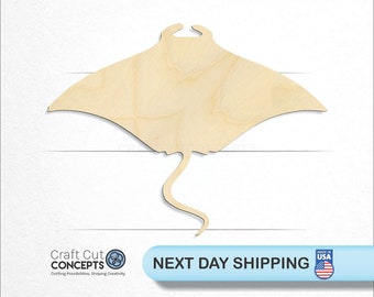 May include: A wooden cutout of a manta ray, a large, flat fish with wing-like fins. The cutout is made of light-colored wood and is ready for painting or staining.