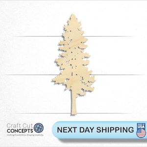 May include: A wooden cutout of a pine tree, with a detailed silhouette of branches and needles. The tree is a light brown color and is isolated on a white background.