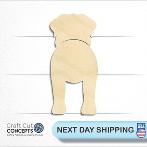 May include: Unfinished wooden cutout of a dog in a sitting position. The cutout is made of light brown wood and is ready to be painted or stained.