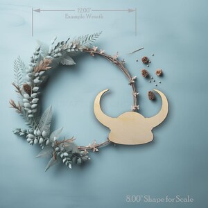 Vikings Norse Helmet Shape wood craft shape on a wreath showing scale.