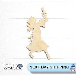 May include: A wooden cutout of a girl holding a nutcracker. The girl is wearing a dress and has long hair. The nutcracker is in her right hand and she is holding it up in the air. The cutout is made of unfinished wood.