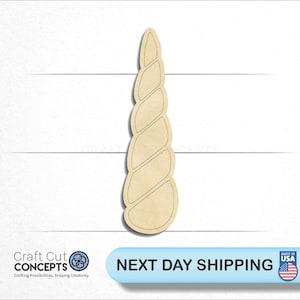 May include: A wooden cutout of a spiral unicorn horn. The horn is light brown and has a smooth, polished finish.
