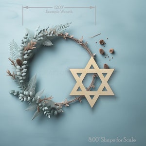 Star of David wood craft shape on a wreath showing scale.