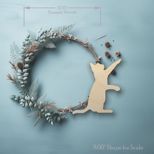 Playful Playing Cat Shape wood craft shape on a wreath showing scale.