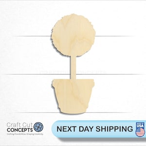 May include: A wooden cutout of a potted topiary tree. The tree is round and the pot is a simple cylinder shape.