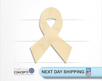 May include: A wooden cutout of a light brown ribbon. The ribbon is in the shape of a traditional awareness ribbon. The ribbon is on a white background.
