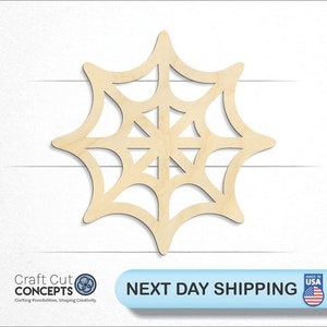 May include: A wooden cutout of a spider web, perfect for Halloween decorations. The web is intricately detailed and has a light wood color.
