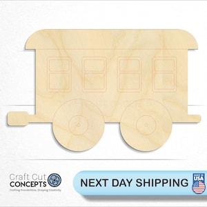 May include: Wooden cutout of a train car with four windows and two wheels. The cutout is made of light brown wood and has a slightly rounded roof.