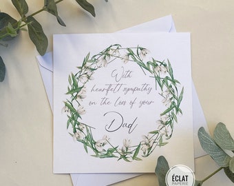 With heartfelt sympathy on the loss of your Dad, condolences card, white floral wreath, snowdrops, bereavement card