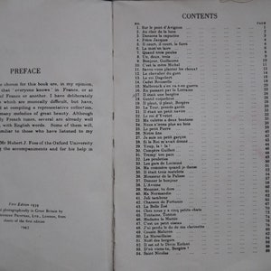 May include: A black and white book with the title "French Folk Songs" and a table of contents listing song titles and page numbers.
